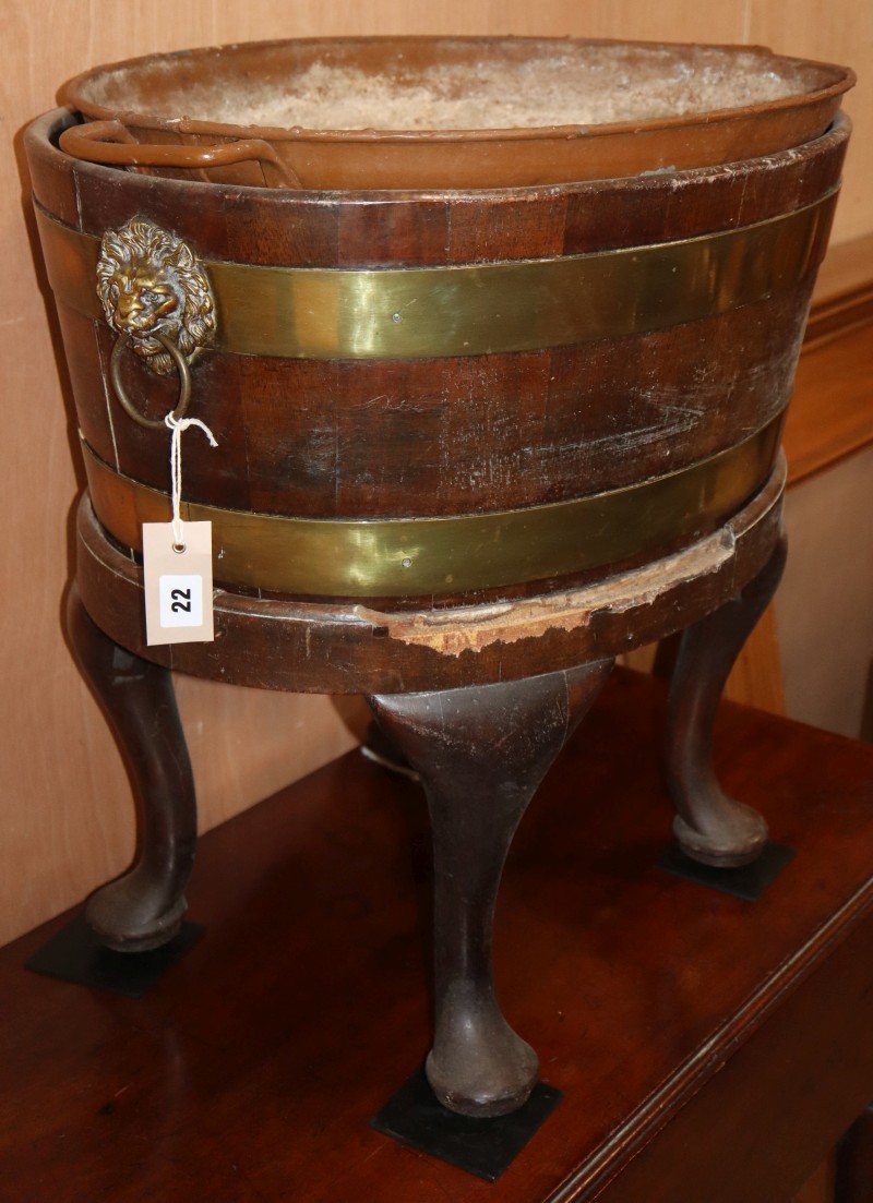 A 19th century brass-bound oval mahogany wine cooler, W.64cm, D.46cm, H.58cm